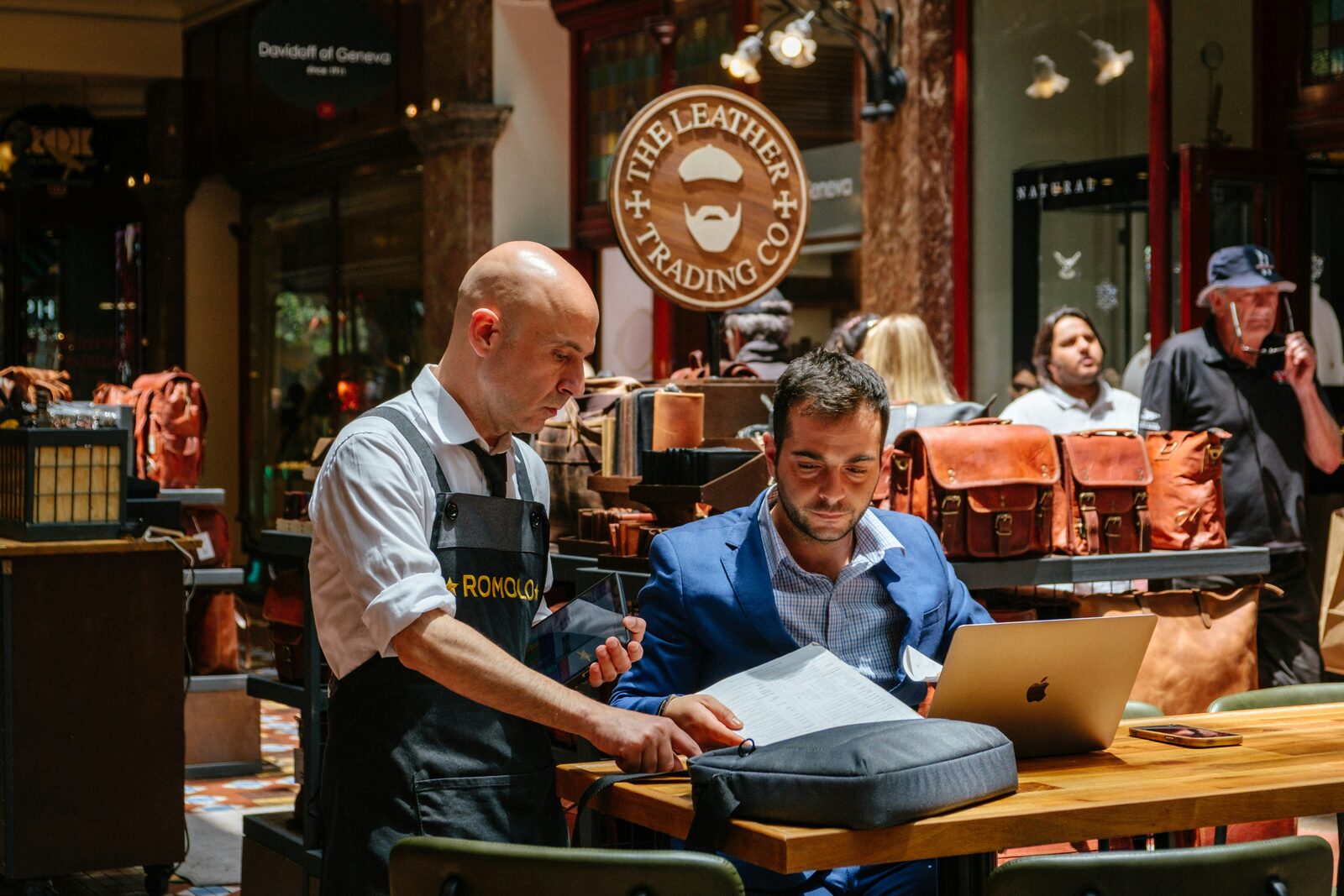 A business owner working through their website with a professional
